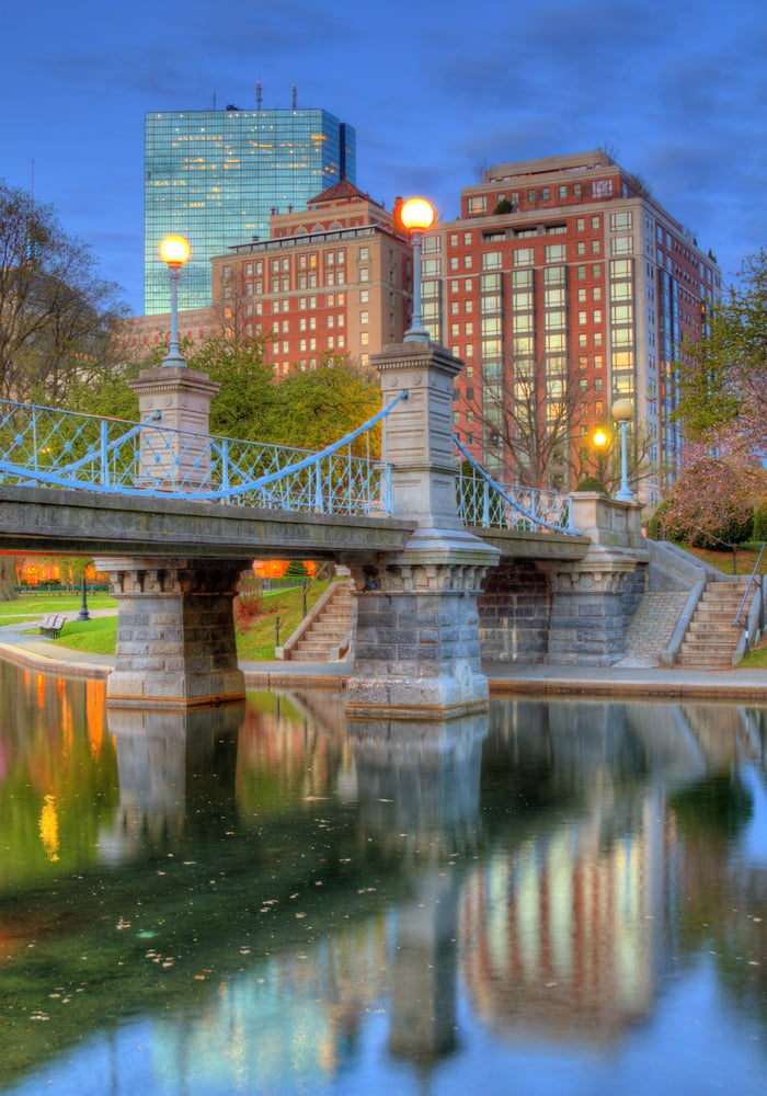 Lagoon Bridge and skyline of Boston, Massachusetts fromthe Boston Public Gardens.